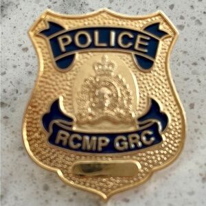 RCMP / GRC Gold and Blue Police Badge Pin. For collectors that passionate.